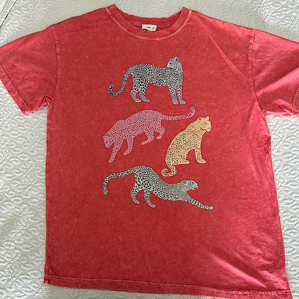 12PM brand t-shirt.
